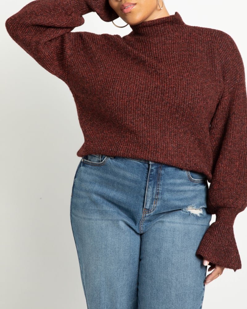 Front of a model wearing a size 14/16 Alisha Flare-Sleeve Sweater in Heather Burgundy by ELOQUII. | dia_product_style_image_id:241953